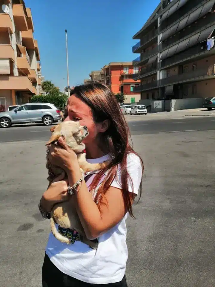 woman-holding-and-hugging-her-dog